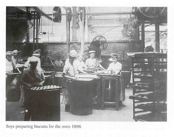 Photo of boys preparing biscuits for the oven